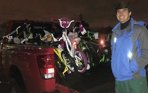 Dayton Prudhomme delivering dental school Salvation Army Angel Tree bikes